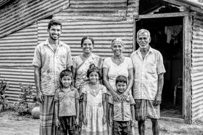 A family together outside their home