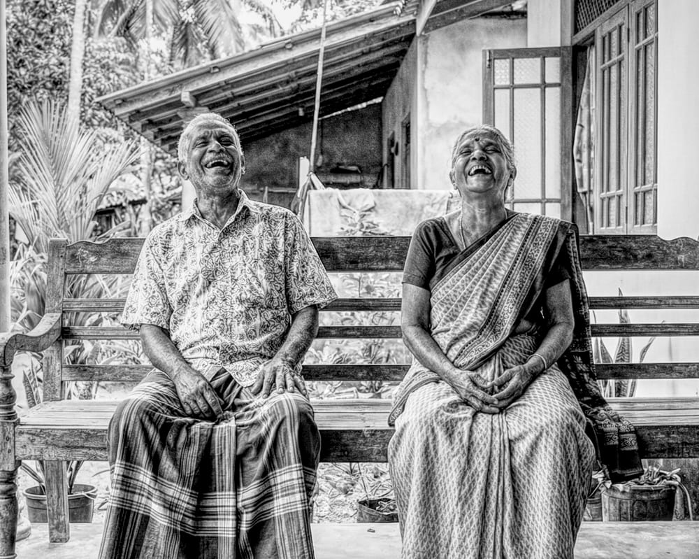 An older couple laughing together